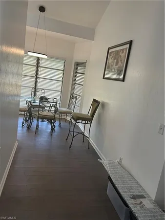 a reading room with furniture and window