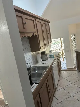 a kitchen with a sink and washing machine