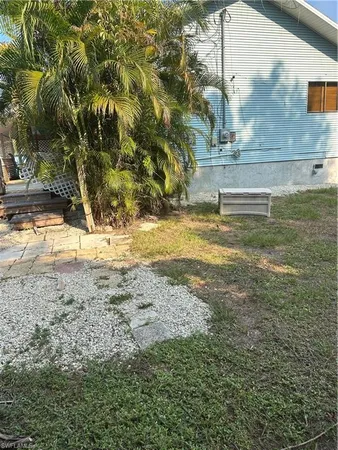 a view of a yard with a tree