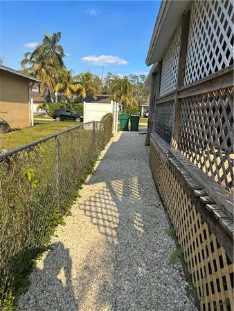 a view of a balcony with wooden floor