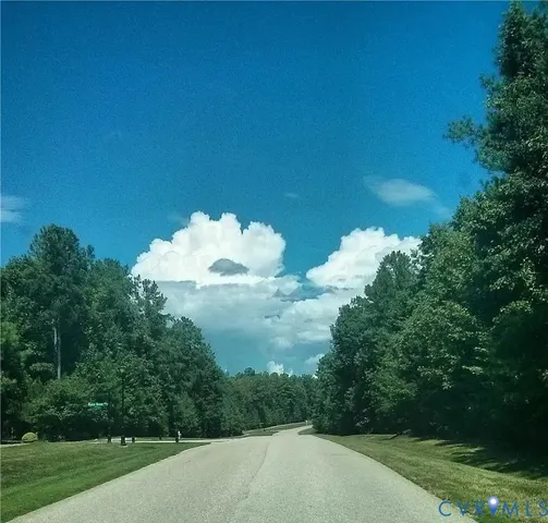 a view of a lake and mountain in the background