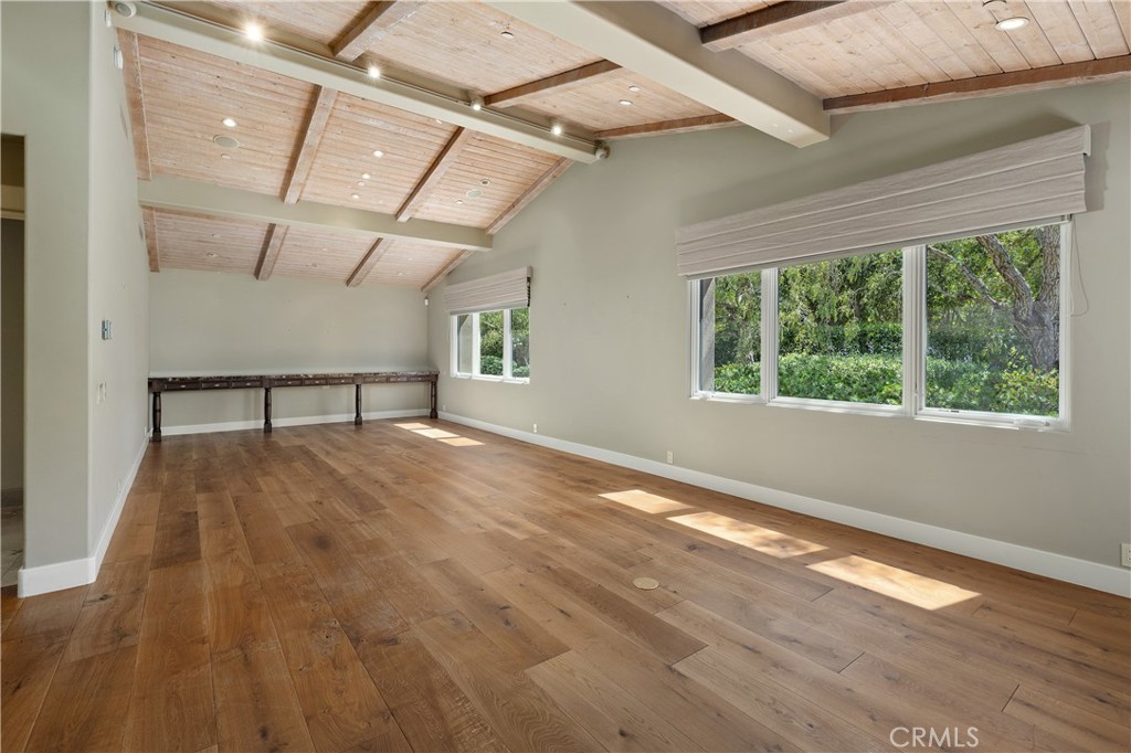 6533 Lago Lindo Rancho Santa Fe, CA 92067 - Photo 36 of 57 a view of empty room with wooden floor and fan