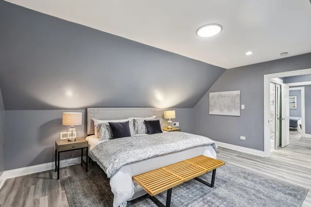 a bedroom with a bed and a couch