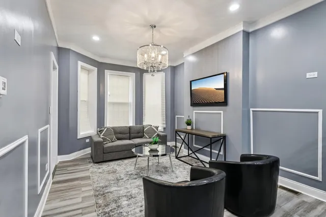a living room with fireplace furniture and a flat screen tv