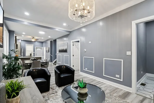 a living room with furniture potted plant and a window