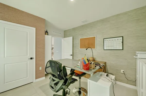 a view of a workspace with furniture