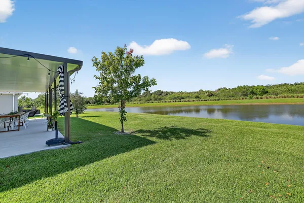 a view of a lake with a yard