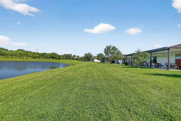 a view of a golf course with a lake