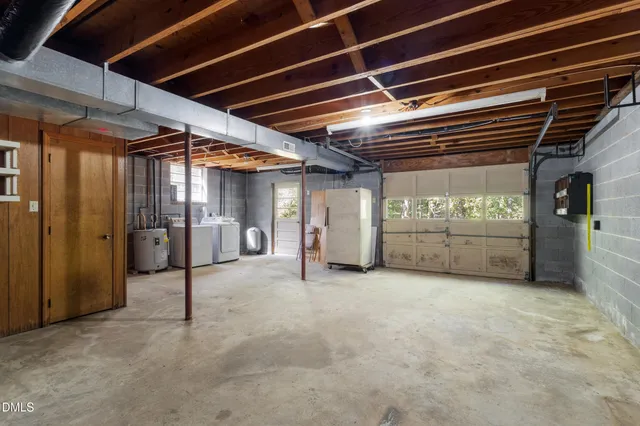 a view of an empty room with a fireplace