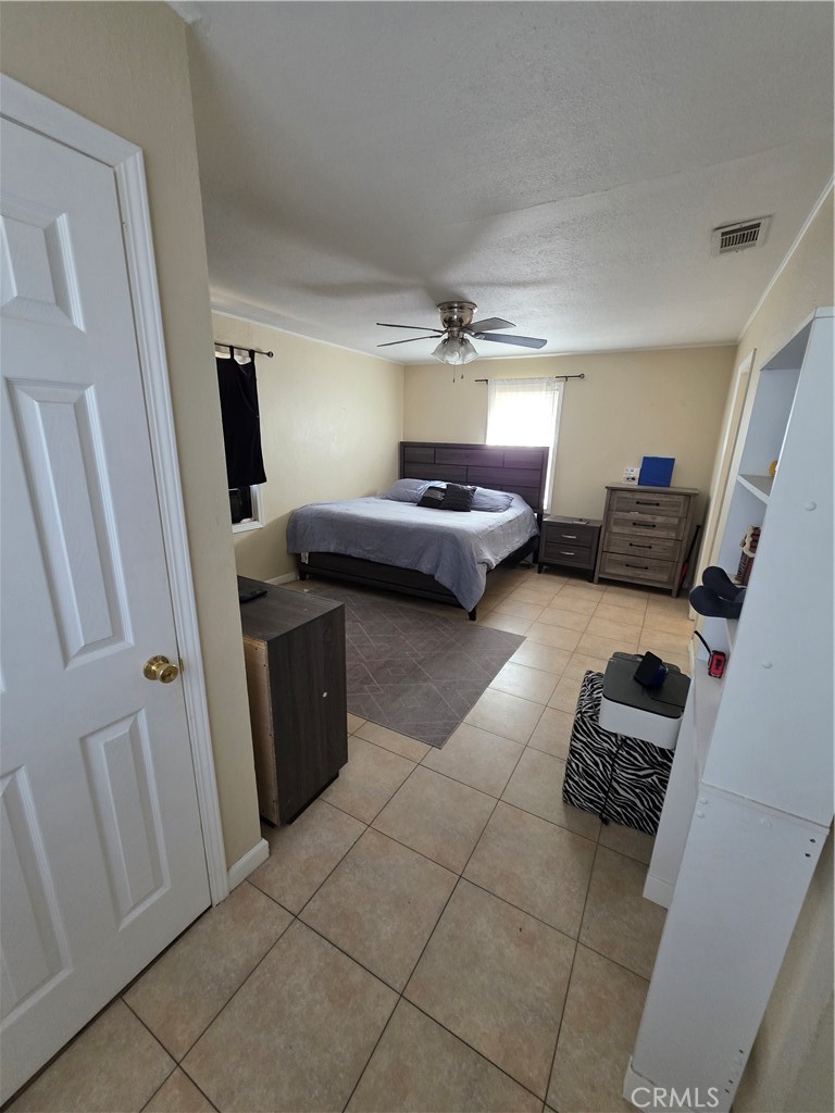 338 South Gilbert Street Hemet, CA 92543 - Photo 7 of 14 a bedroom with furniture and a tub