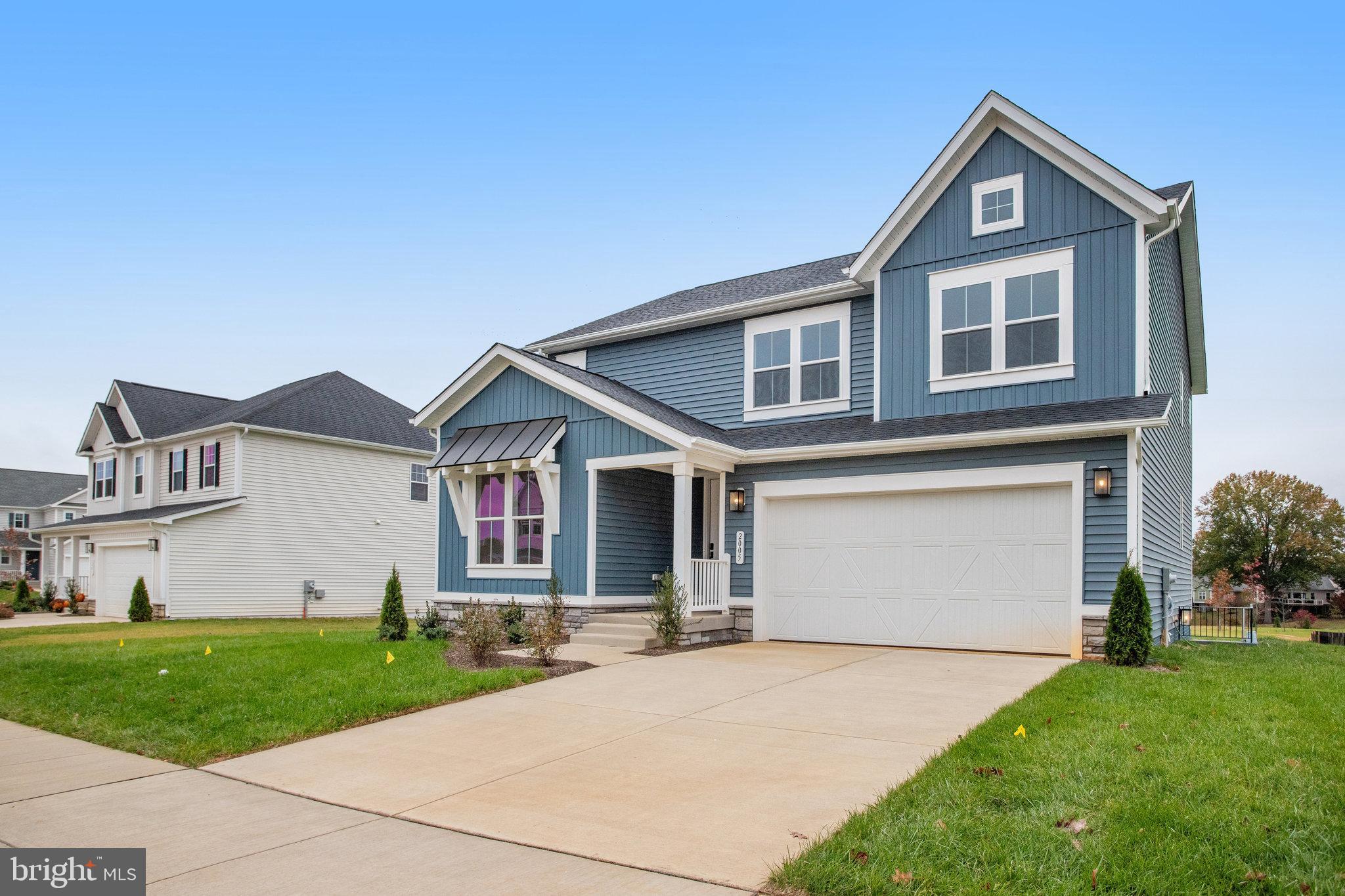 2005 Divot Drive Culpeper, VA 22701 - Photo 2 of 46 a front view of a house with a yard and garage