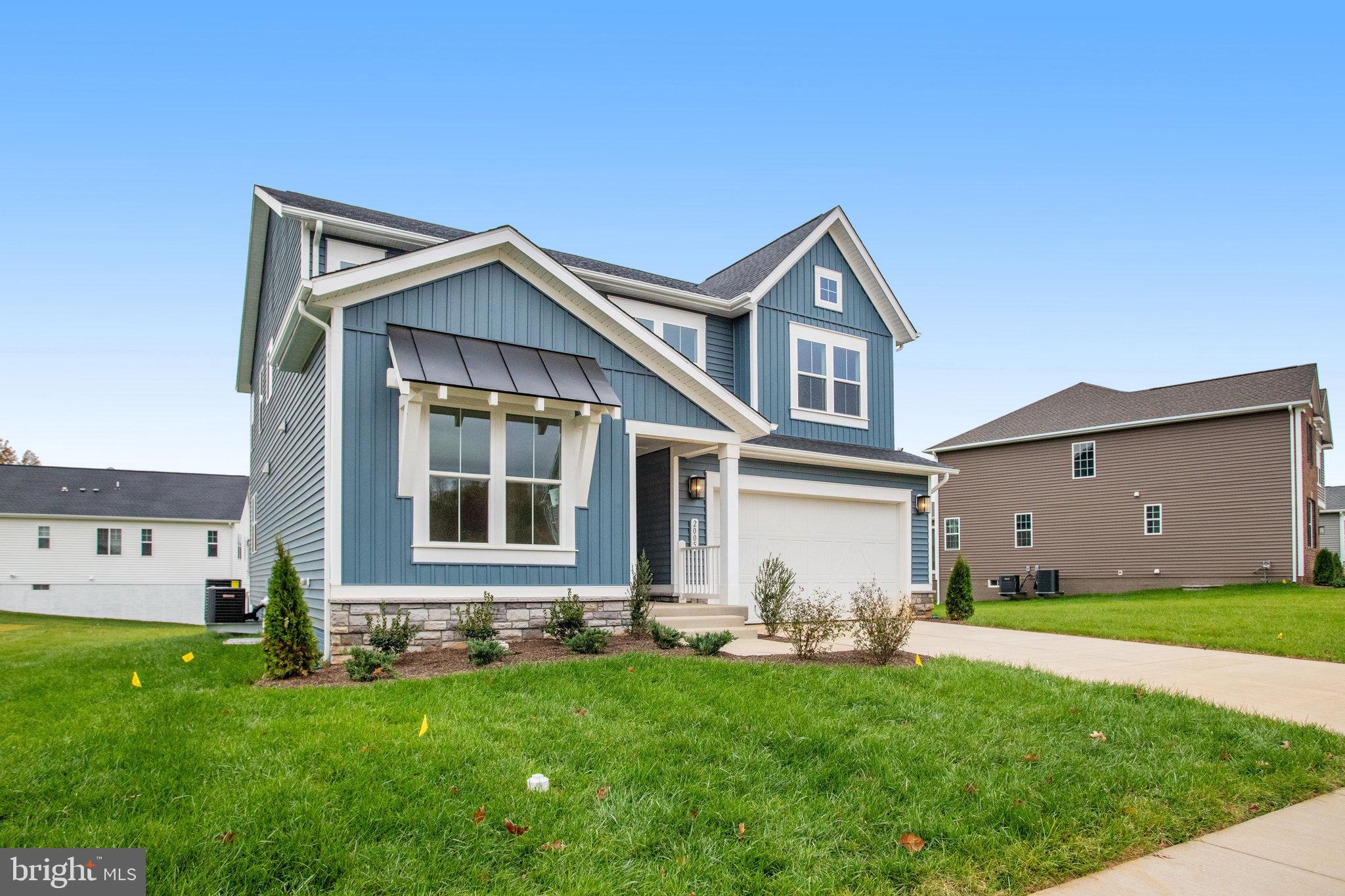 2005 Divot Drive Culpeper, VA 22701 - Photo 3 of 46 a front view of a house with a yard and garage