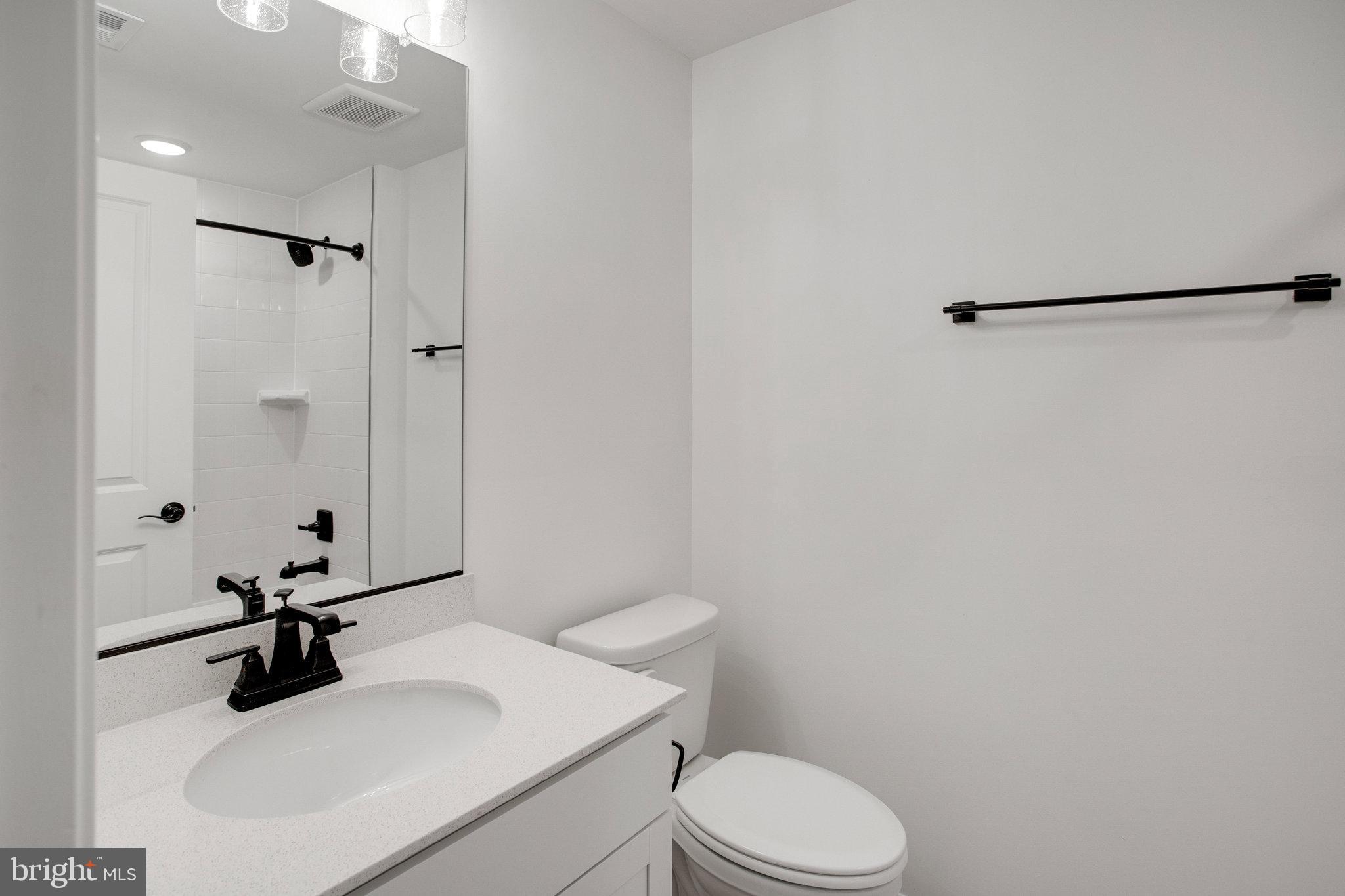 2005 Divot Drive Culpeper, VA 22701 - Photo 38 of 46 a bathroom with a sink vanity mirror and toilet