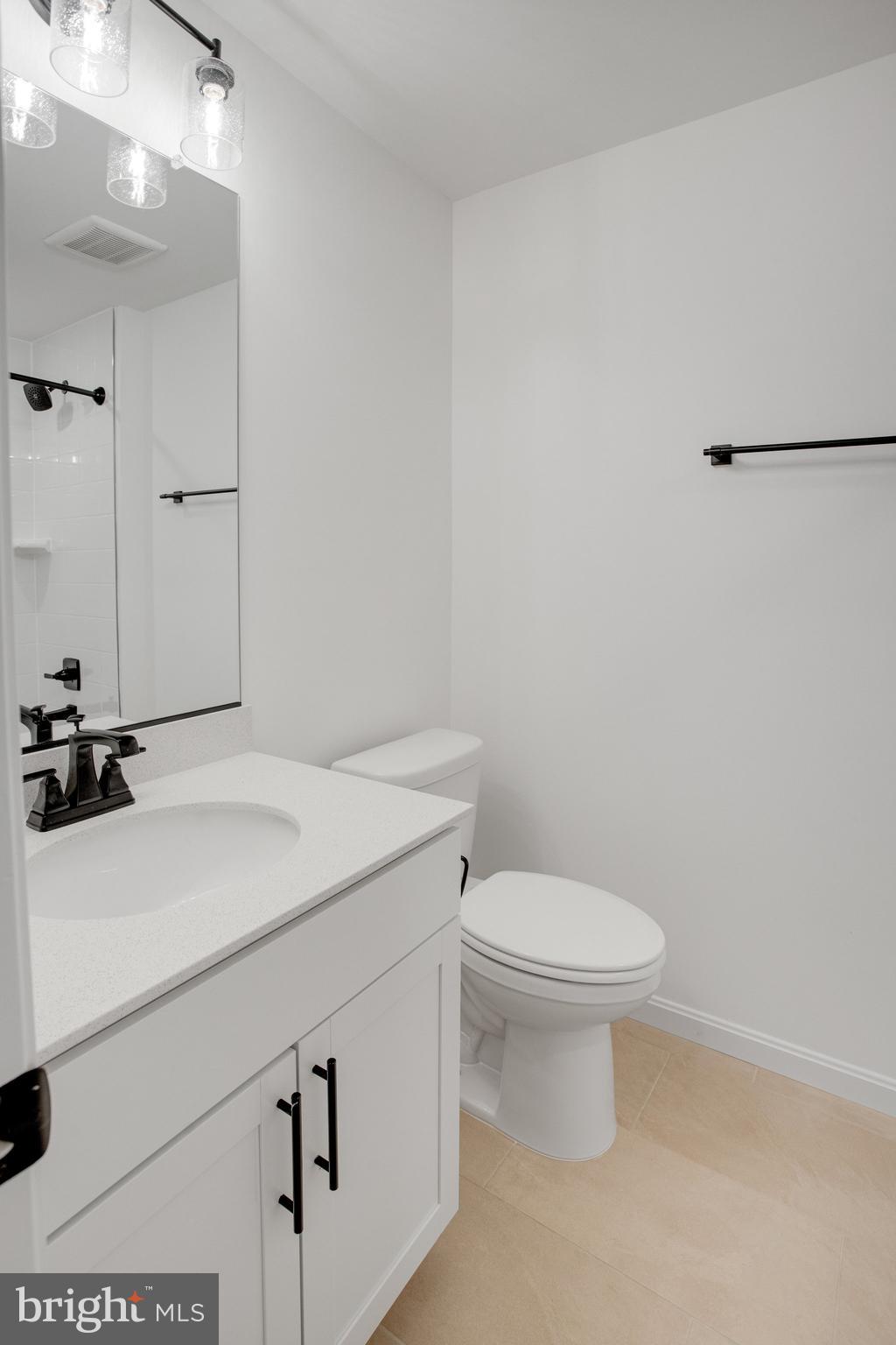 2005 Divot Drive Culpeper, VA 22701 - Photo 39 of 46 a bathroom with a sink a toilet and a mirror