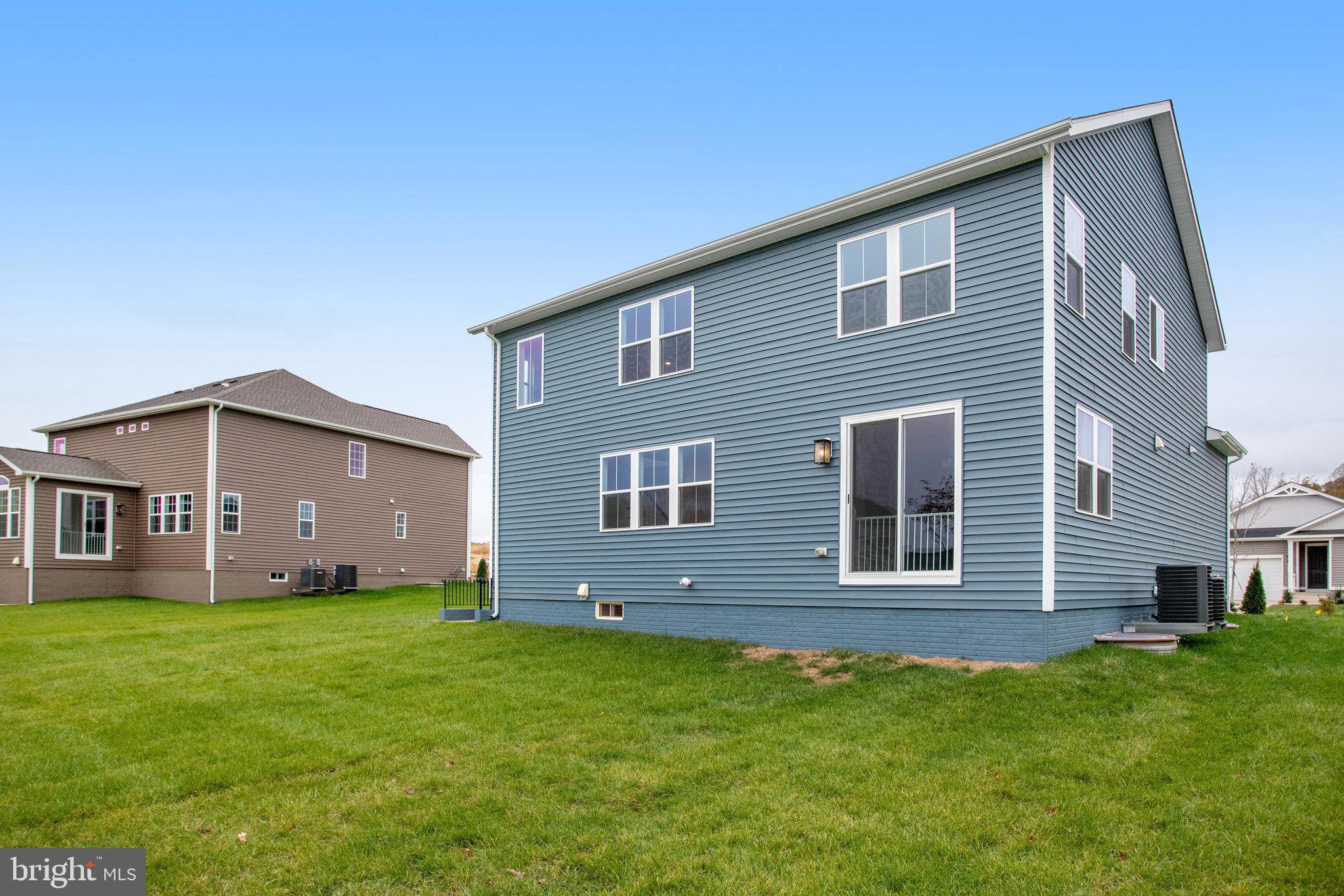 2005 Divot Drive Culpeper, VA 22701 - Photo 44 of 46 a front view of a house with a yard and garage