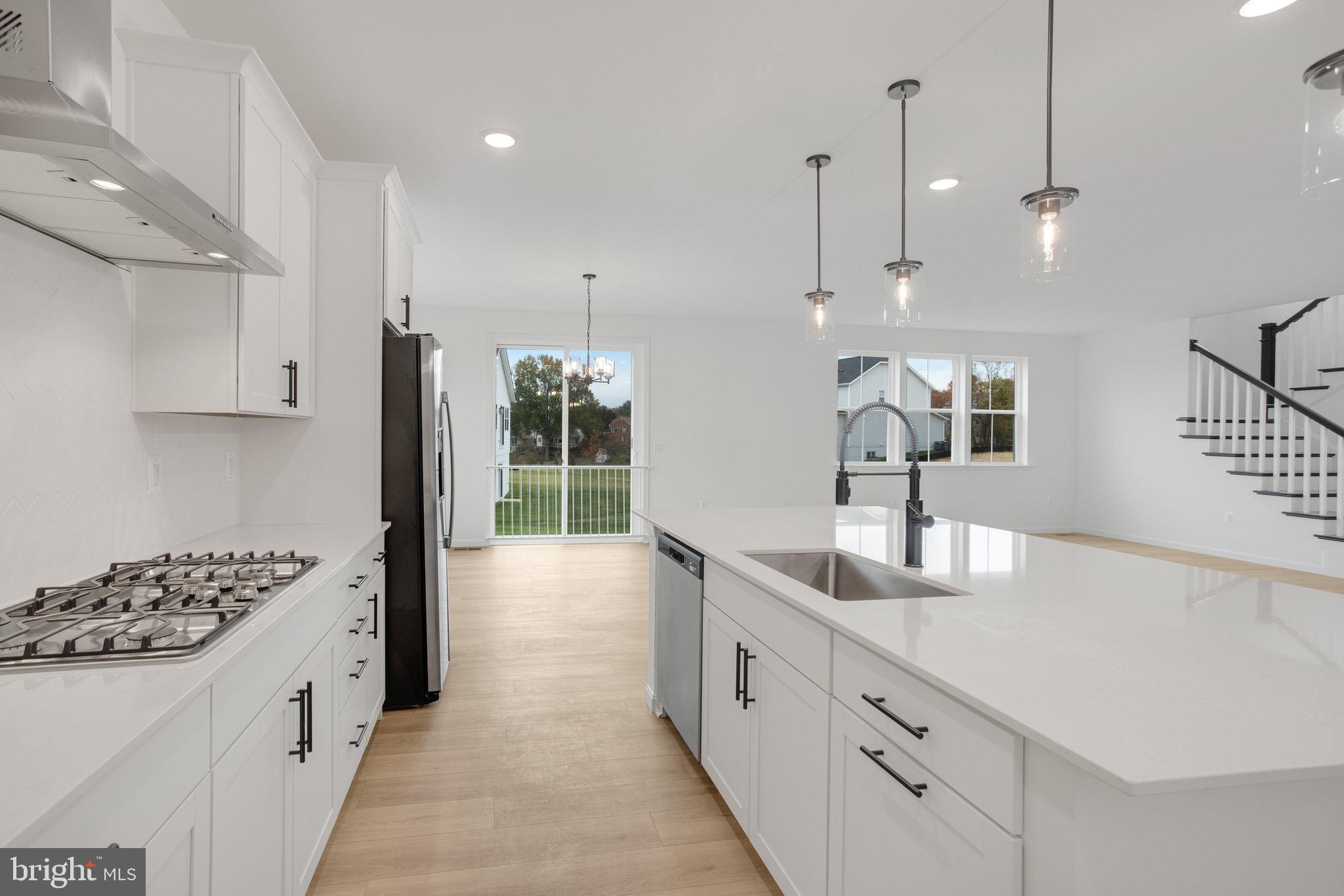 2005 Divot Drive Culpeper, VA 22701 - Photo 10 of 46 a large kitchen with kitchen island a sink stainless steel appliances and cabinets