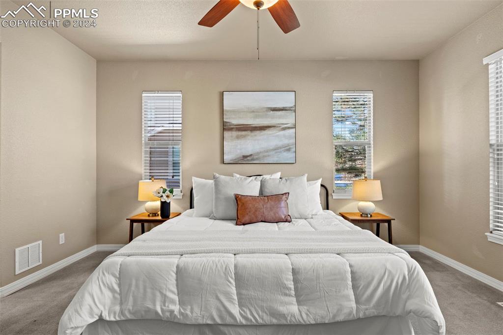 2464 Cinnabar Road Colorado Springs, CO 80921 - Photo 17 of 43 a bedroom with a bed and window