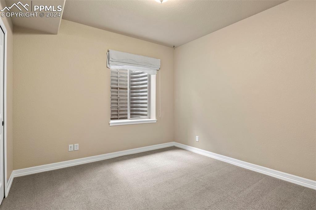 2464 Cinnabar Road Colorado Springs, CO 80921 - Photo 27 of 43 an empty room with a window