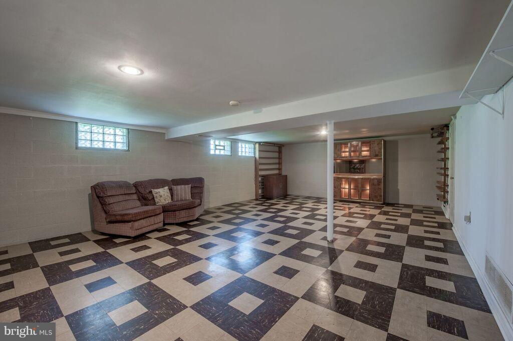 3824 Offutt Road Randallstown, MD 21133 - Photo 19 of 27 a bedroom with furniture and a rug