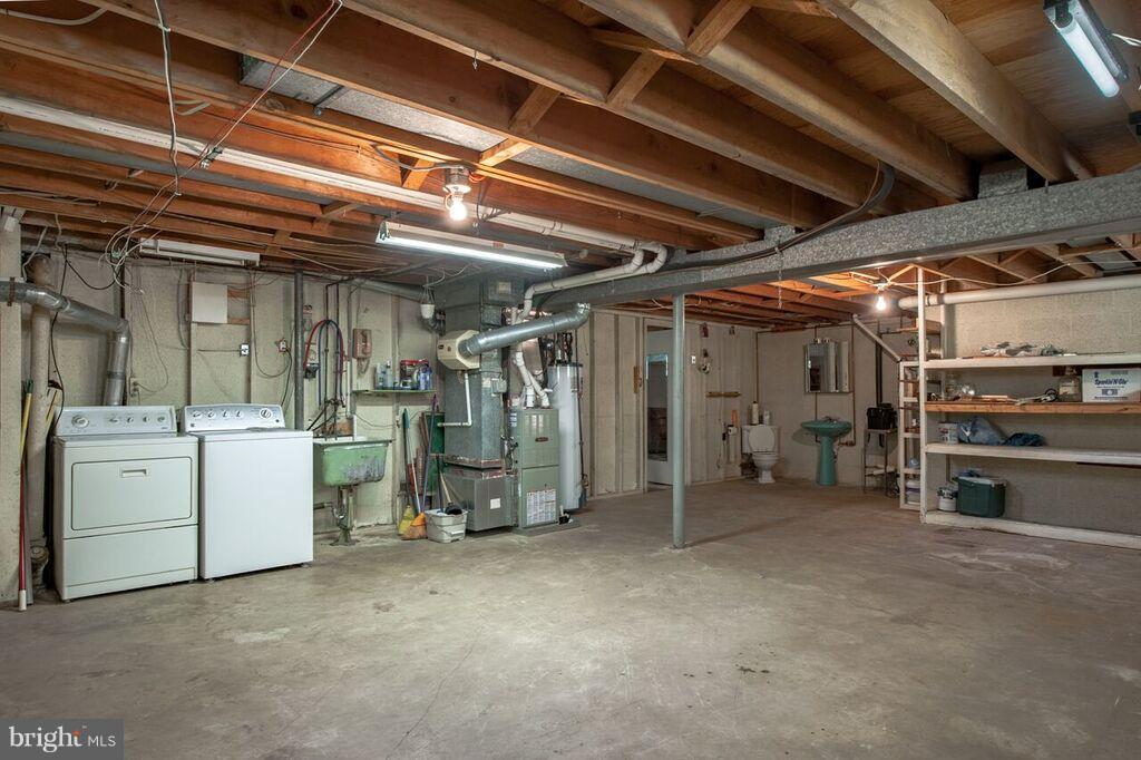 3824 Offutt Road Randallstown, MD 21133 - Photo 21 of 27 a view of water heater room with window