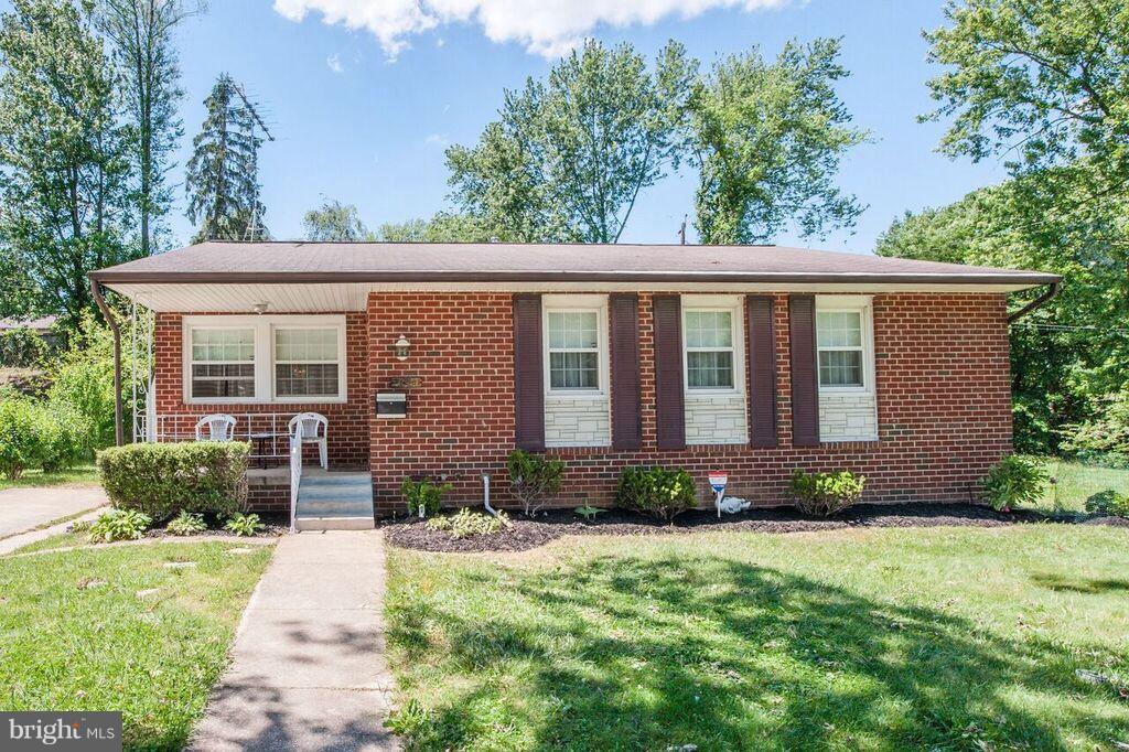 3824 Offutt Road Randallstown, MD 21133 - Photo 4 of 27 a front view of a house with garden