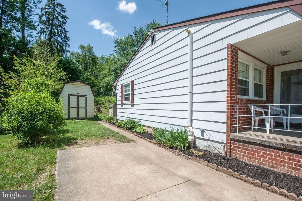 3824 Offutt Road Randallstown, MD 21133 - Photo 5 of 27 a front view of a house with a yard