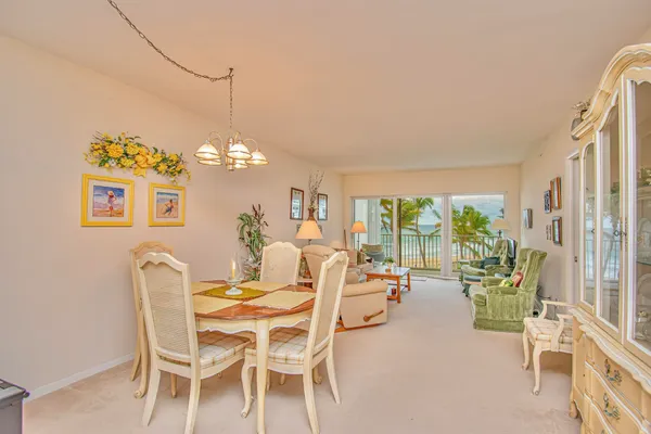 a dining room with furniture and chandelier