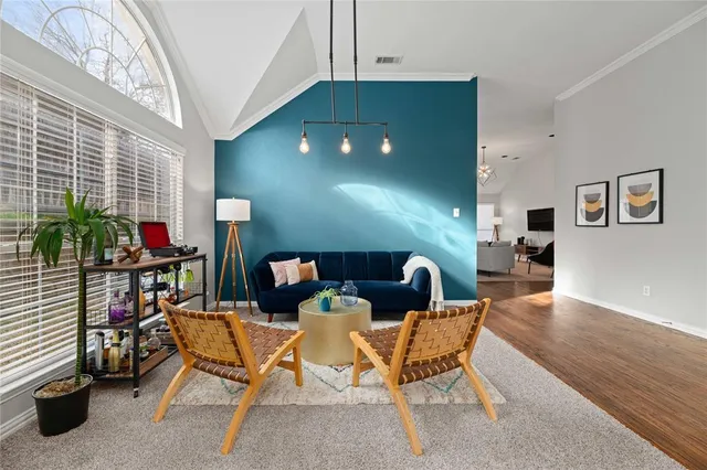 a dining room with furniture and wooden floor