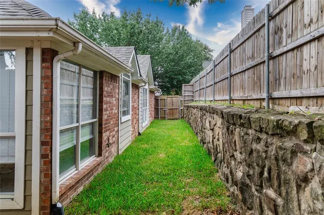 a view of a back yard of the house