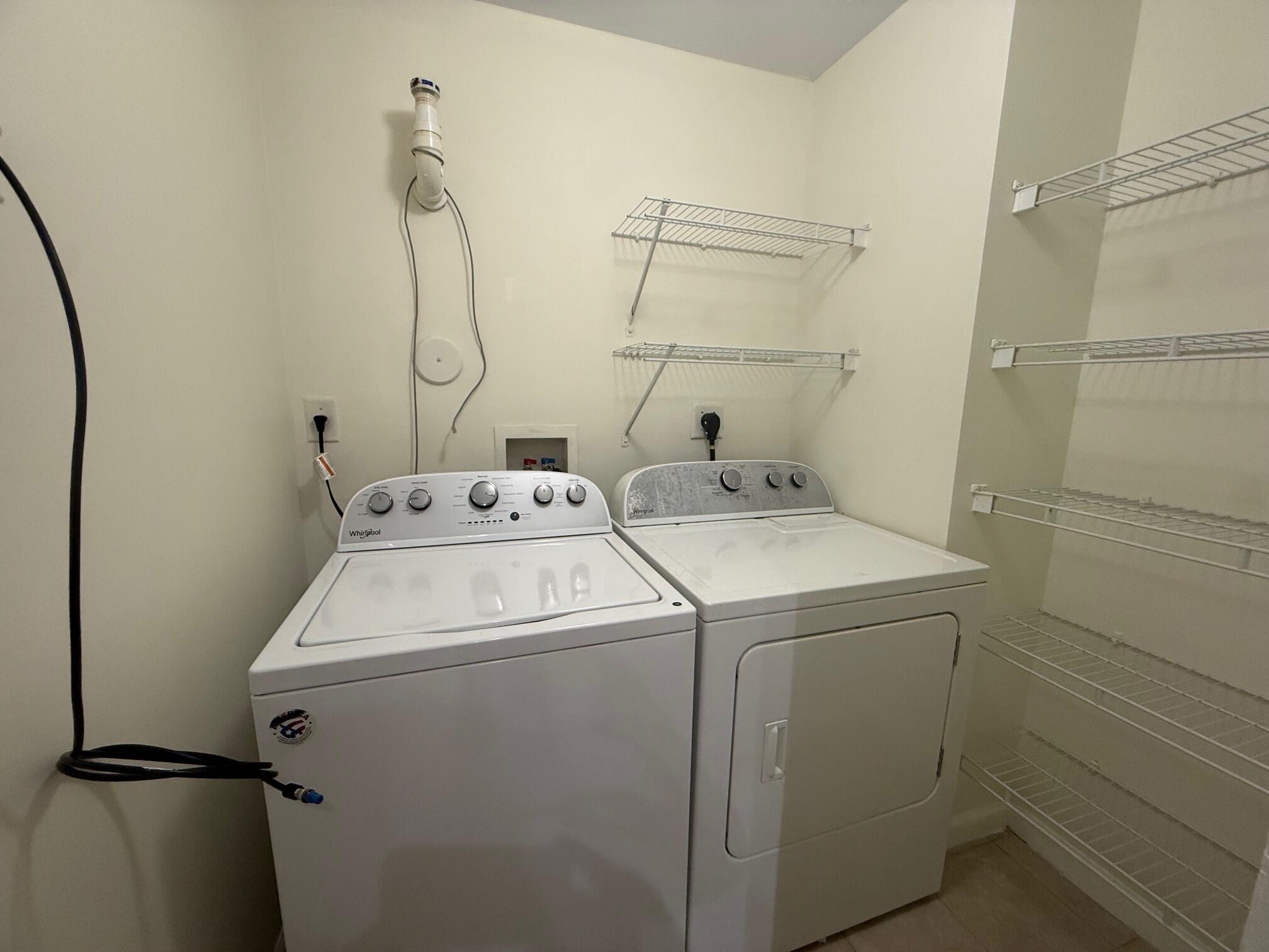 5800 West Sample Road, Unit 207 Coral Springs, FL 33067 - Photo 12 of 22 a utility room with dryer and washer