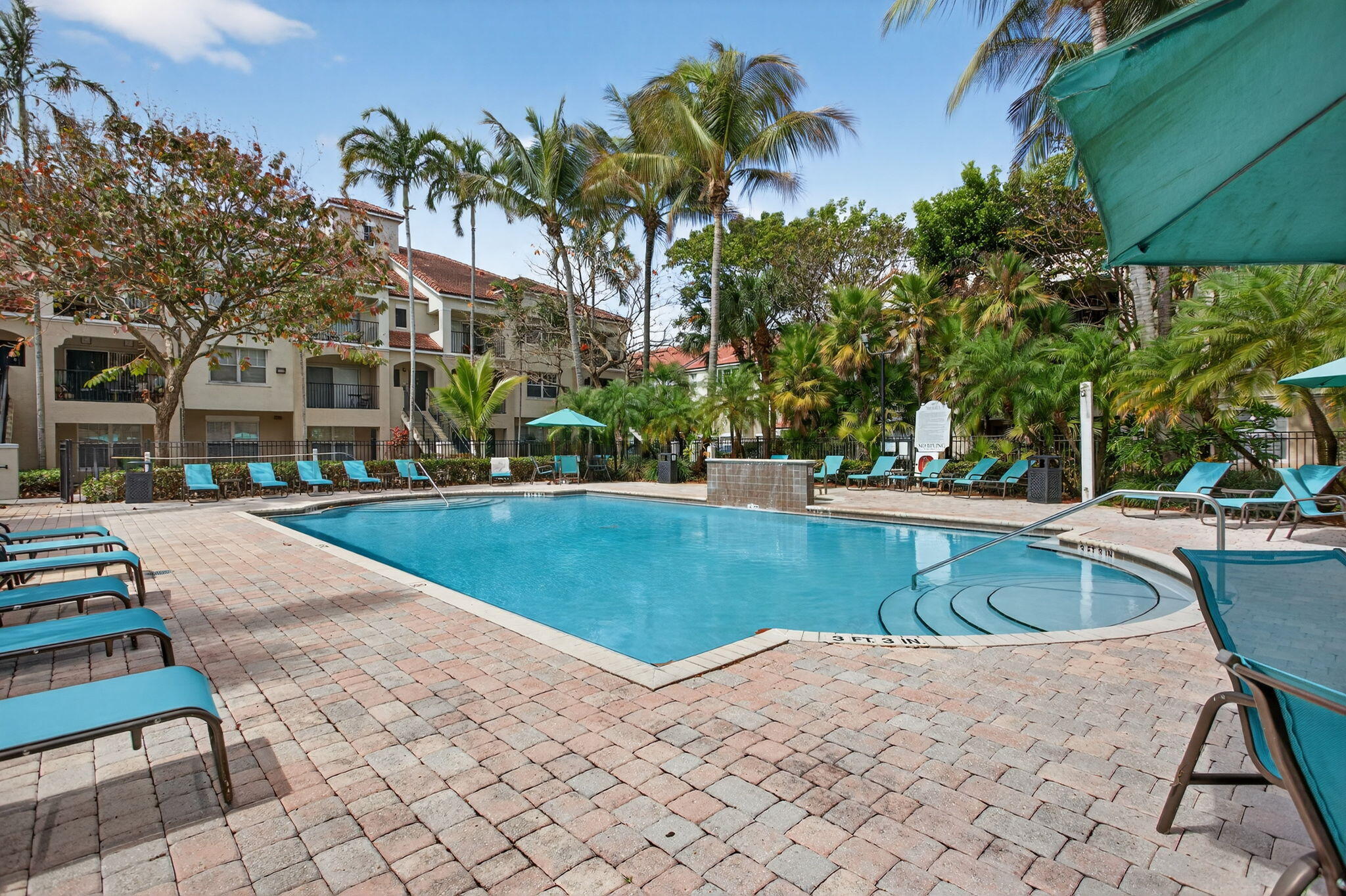 5800 West Sample Road, Unit 207 Coral Springs, FL 33067 - Photo 17 of 22 a view of outdoor space swimming pool and sitting area