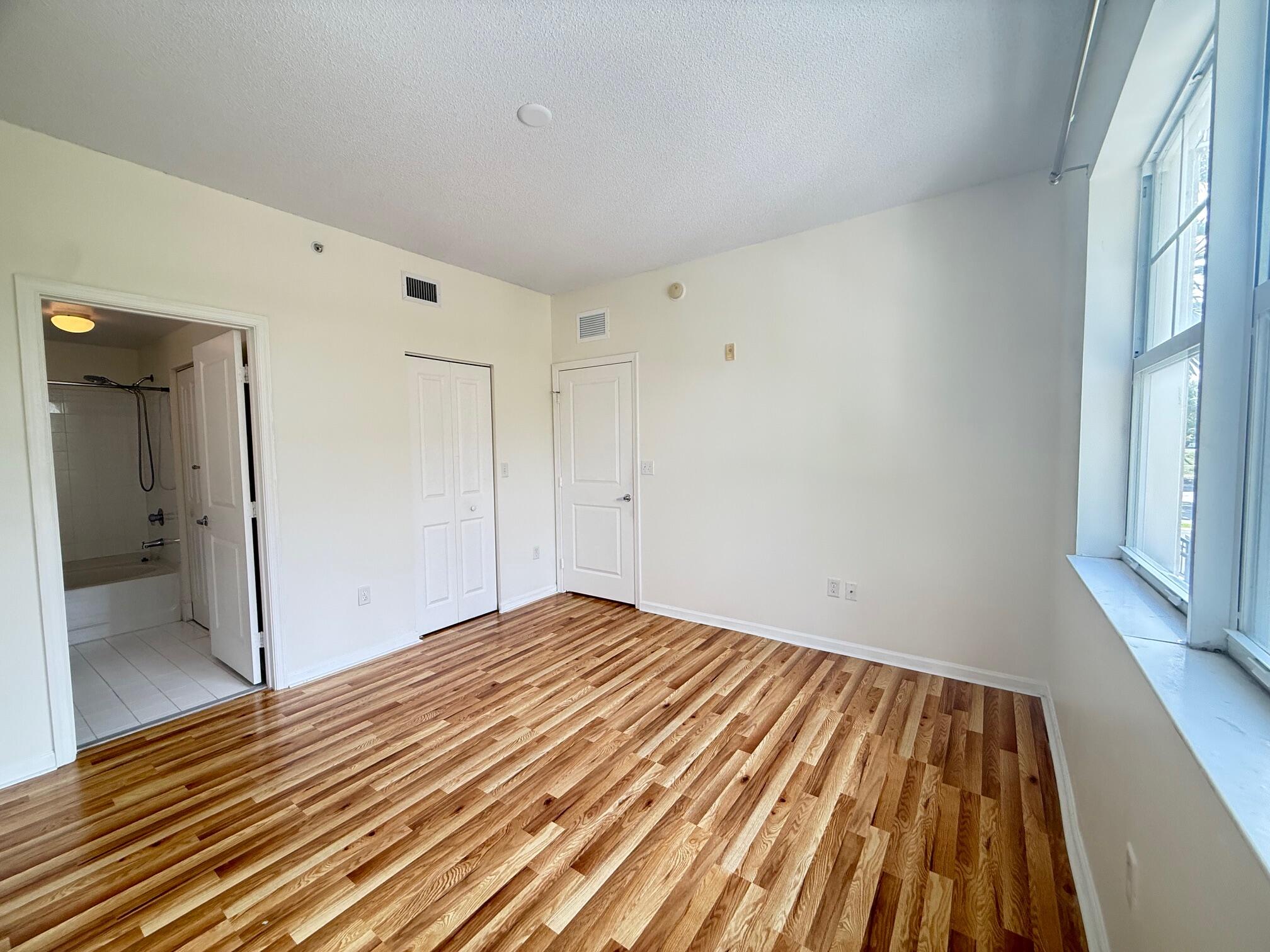 5800 West Sample Road, Unit 207 Coral Springs, FL 33067 - Photo 8 of 22 a view of empty room with wooden floor