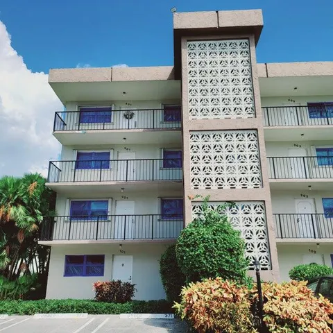 a view of a swimming pool with a lounge chair