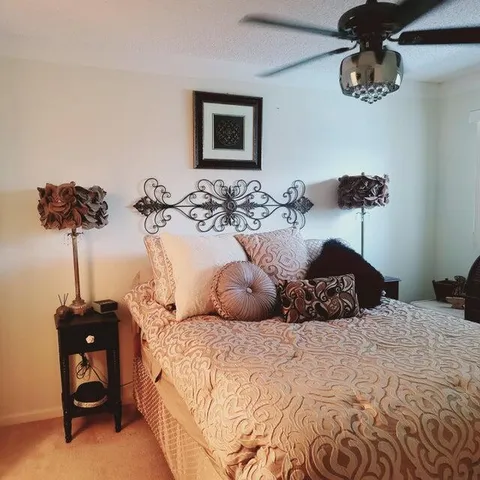 a bedroom with furniture and a window