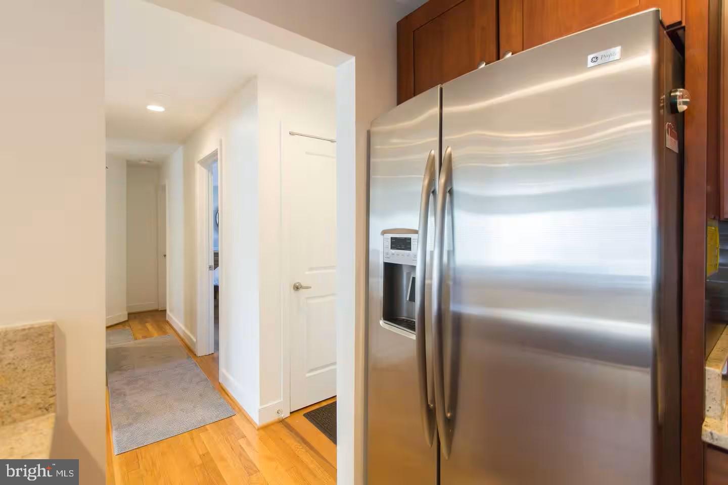 4118 18th Road North Arlington, VA 22207 - Photo 26 of 48 a view of refrigerator in kitchen and an empty room