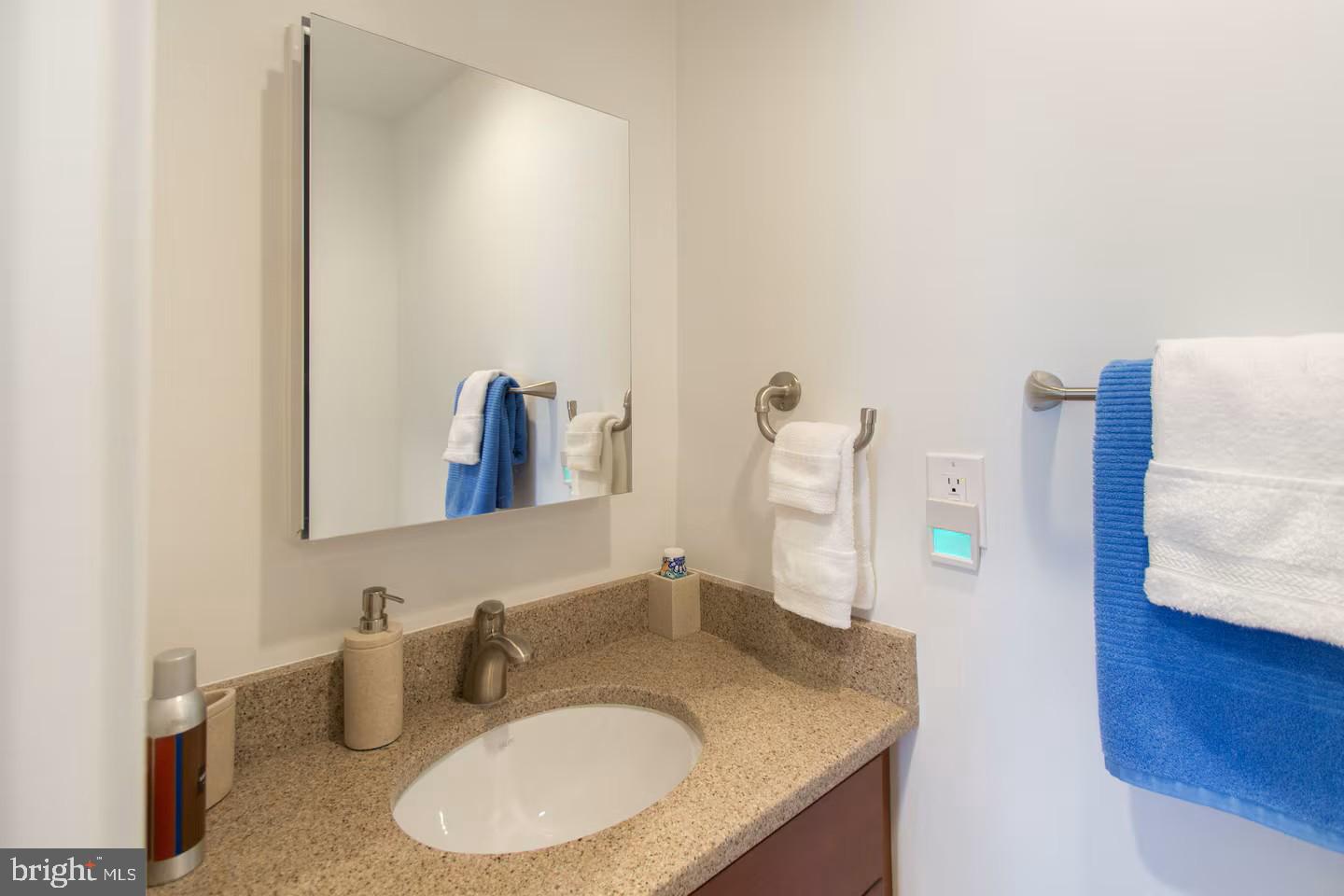 4118 18th Road North Arlington, VA 22207 - Photo 41 of 48 a bathroom with a granite countertop sink and a mirror