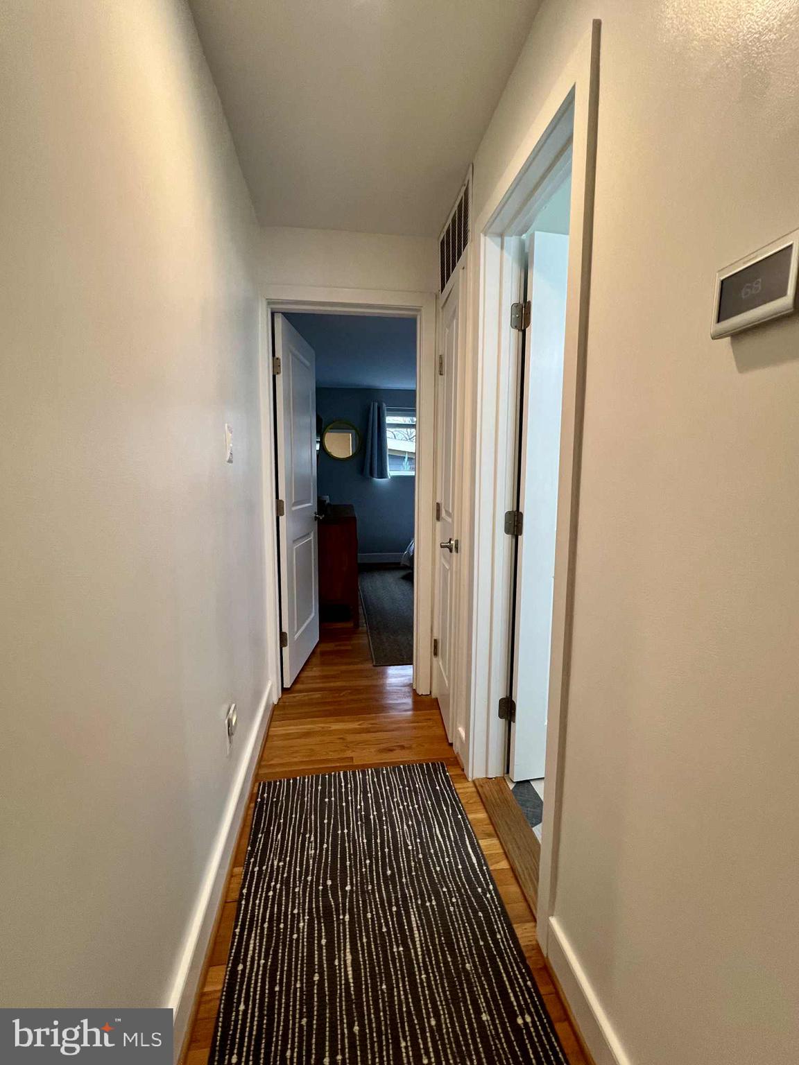 4118 18th Road North Arlington, VA 22207 - Photo 9 of 48 a view of a hallway with wooden floor and staircase