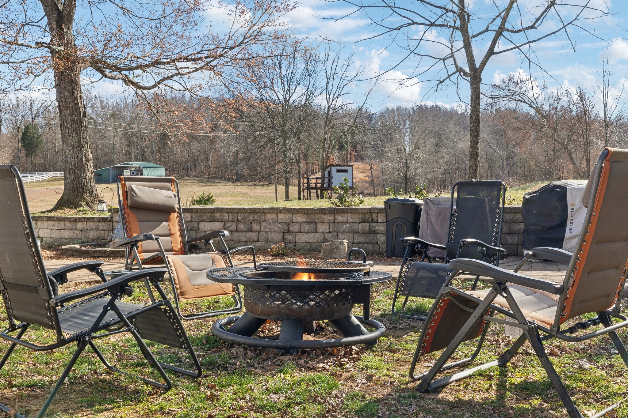 950 Roberts Road Clarksville, TN 37040 - Photo 12 of 35 a view of a patio with table and chairs and barbeque