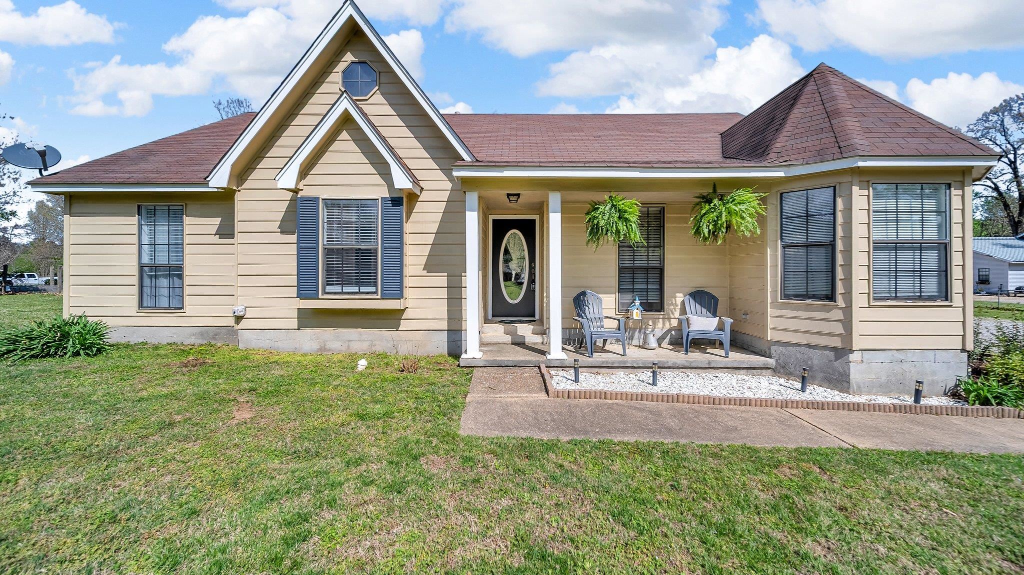 6488 Chase Road Millington, TN 38053 - Photo 1 of 22 View of front of property featuring a front yard, a patio, and roof with shingles