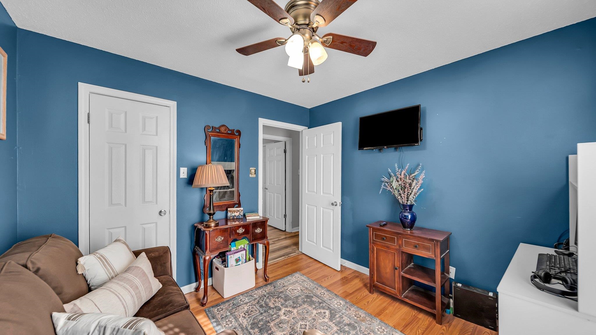 6488 Chase Road Millington, TN 38053 - Photo 17 of 22 Living room featuring wood finished floors, baseboards, and ceiling fan