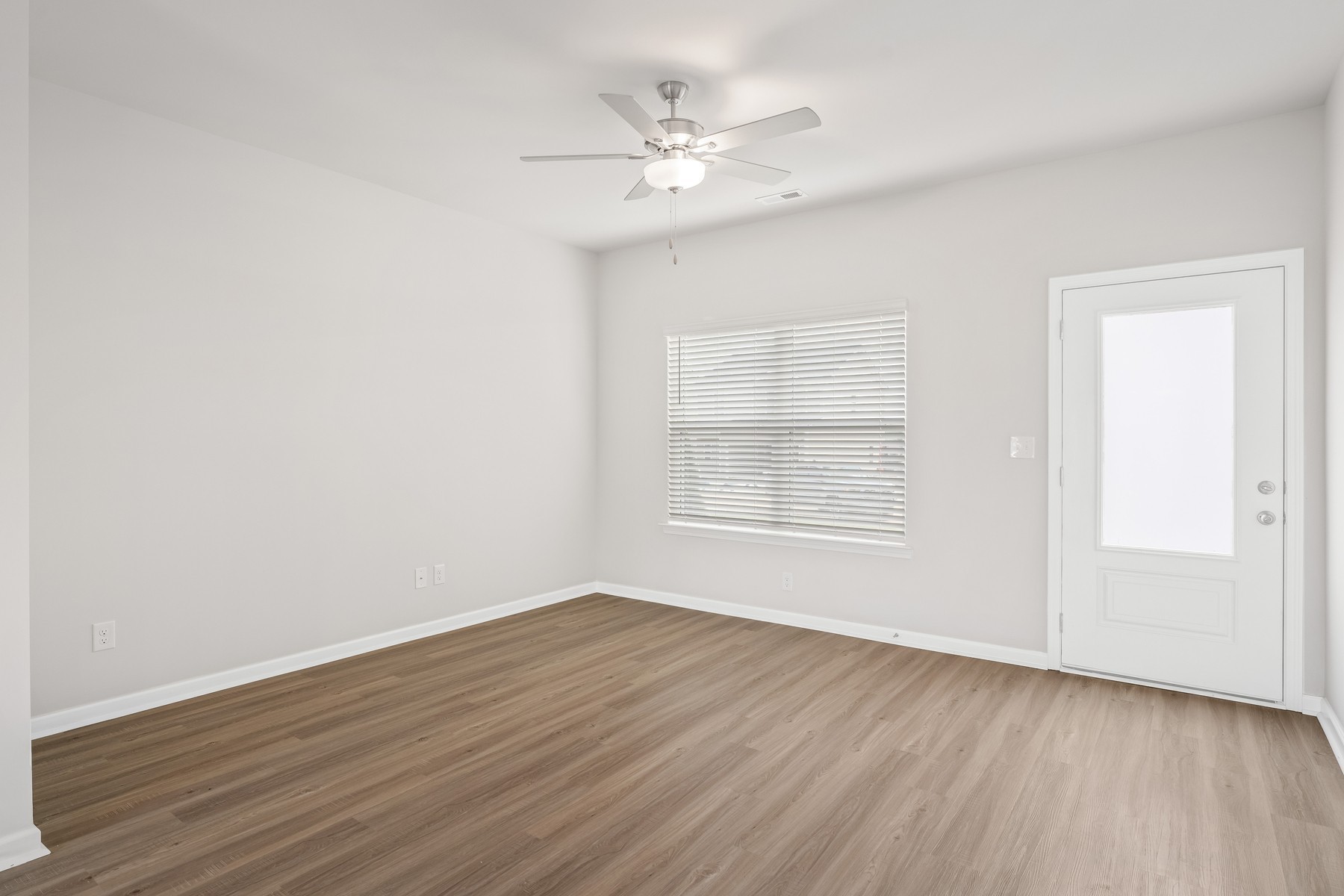 2036 Lala Loop White Bluff, TN 37187 - Photo 3 of 12 an empty room with wooden floor and windows