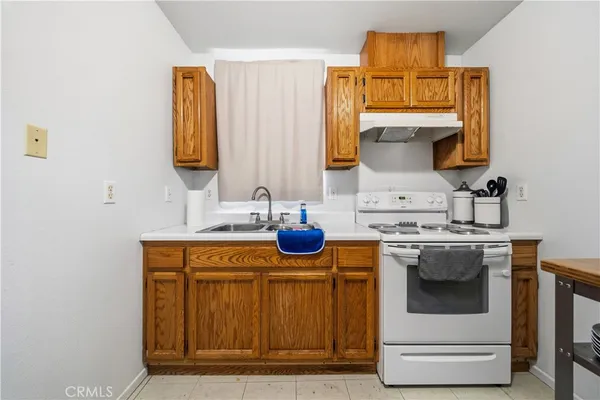 a kitchen with a stove and a sink