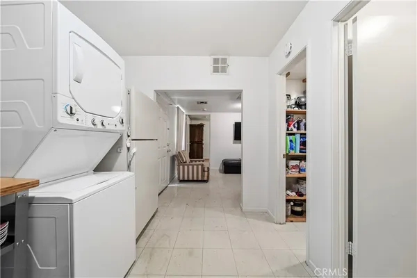 a view of a hallway with washer and dryer