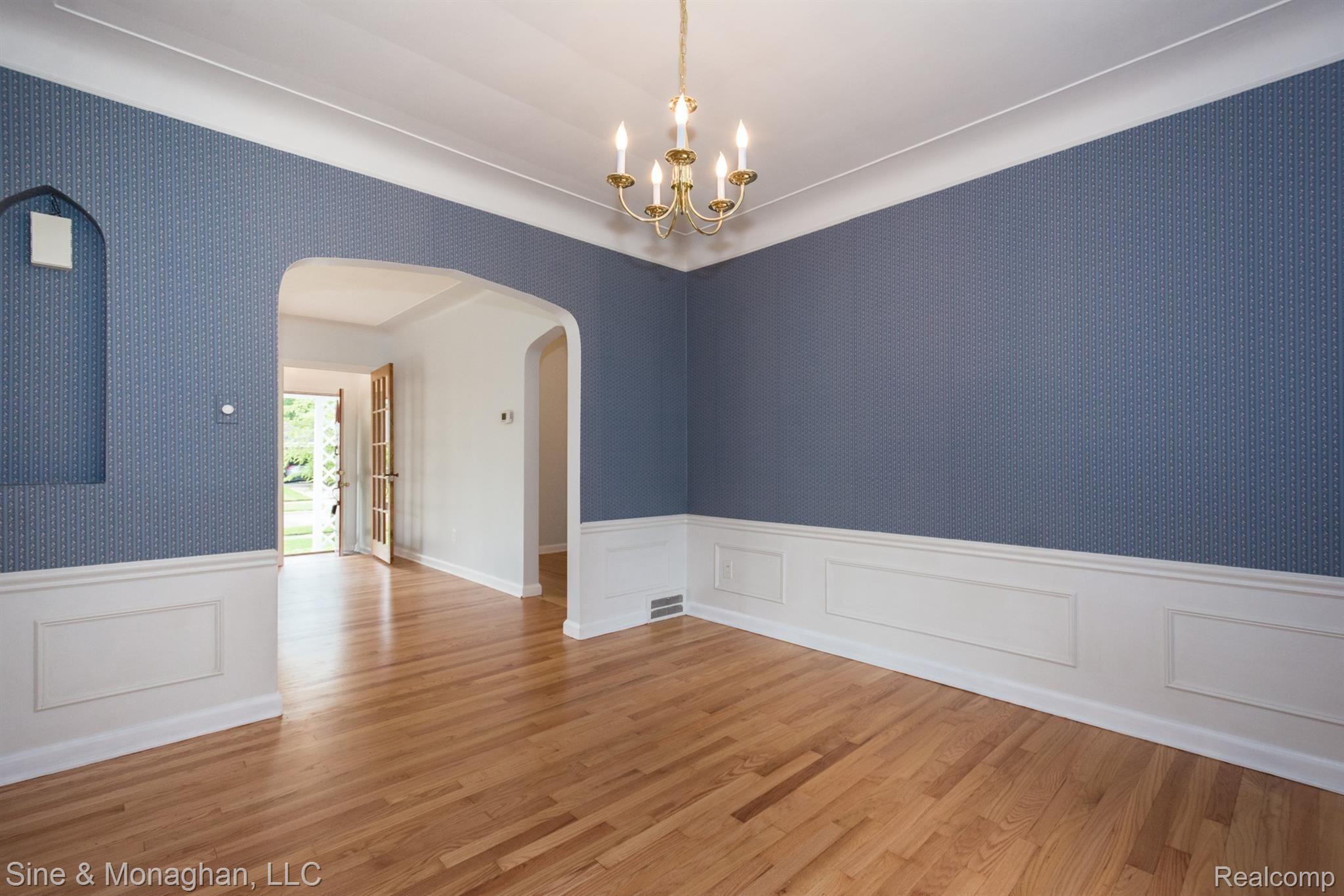 2024 Oxford Road Grosse Pointe, MI 48236 - Photo 5 of 20 Dining Room with Wainscoating and Cove Ceiling