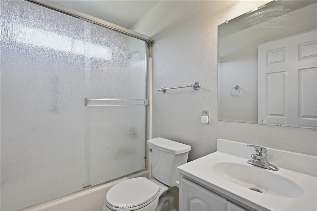 18846 Horseshoe Road Hidden Valley Lake, CA 95467 - Photo 19 of 31 a bathroom with a sink a toilet and shower