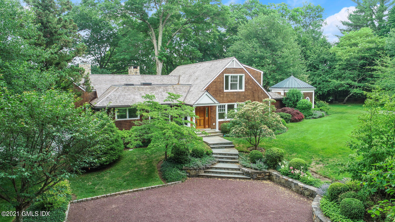 66 Butternut Hollow Road Greenwich, CT 06830 - Photo 2 of 19 an aerial view of a house with a yard