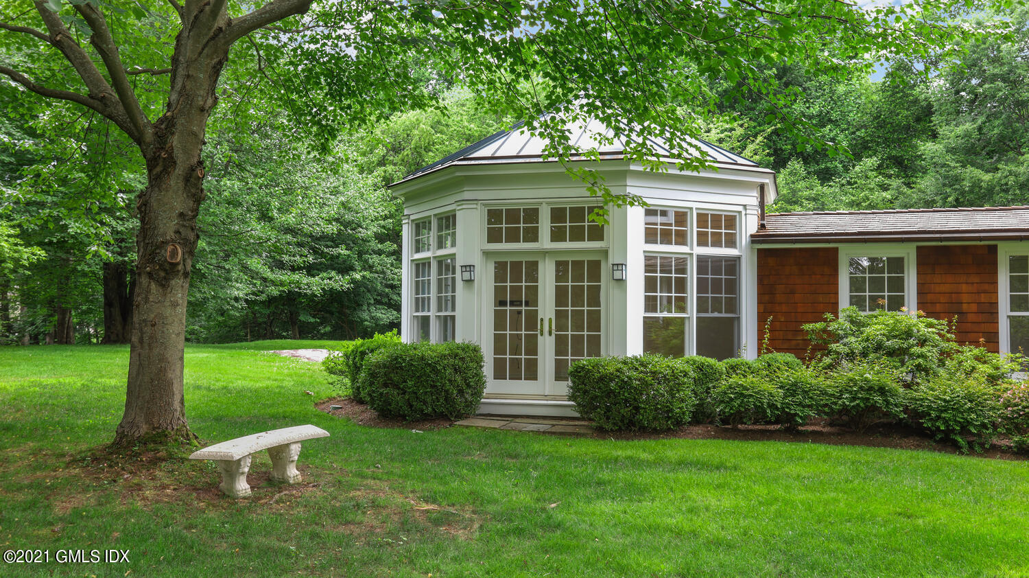 66 Butternut Hollow Road Greenwich, CT 06830 - Photo 4 of 19 a front view of a house with a yard