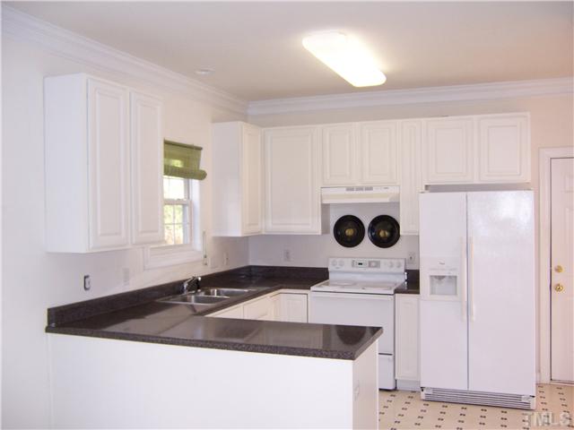9208 Pennythorne Court Raleigh, NC 27615 - Photo 6 of 8 All existings appliances stay "as is". Great counter space and pantry!