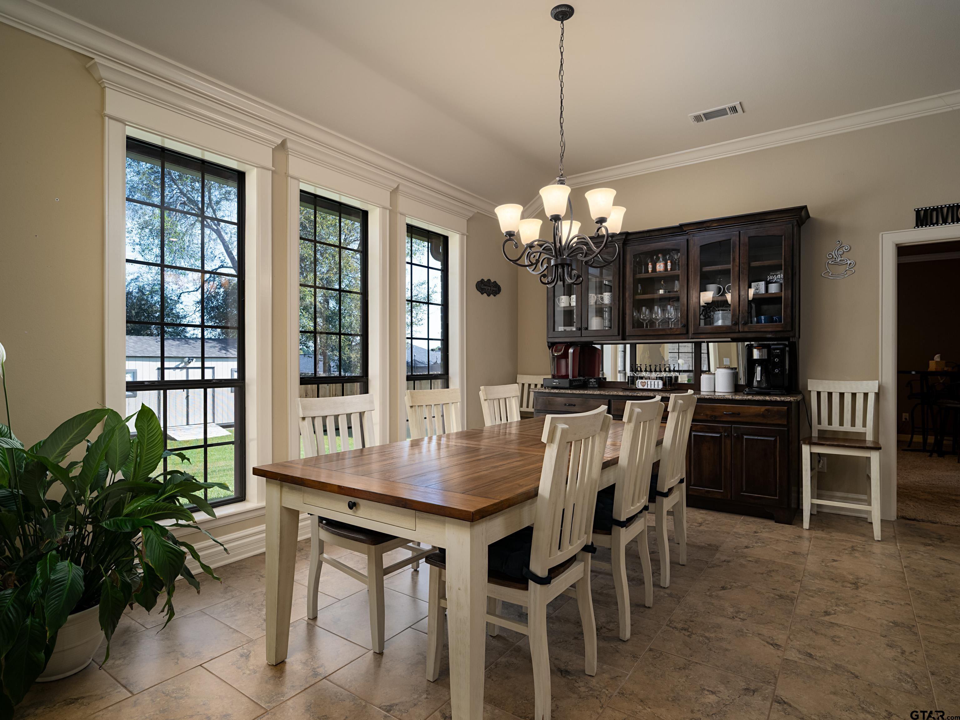 19560 Sandhill Lane Flint, TX 75762 - Photo 11 of 35 a dining room with furniture window and wooden floor