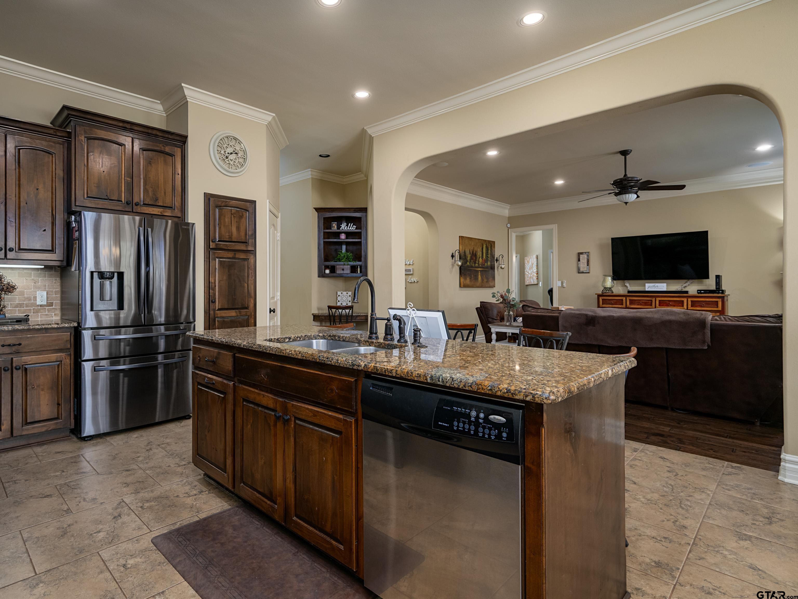 19560 Sandhill Lane Flint, TX 75762 - Photo 14 of 35 a kitchen with stainless steel appliances granite countertop a sink and a refrigerator